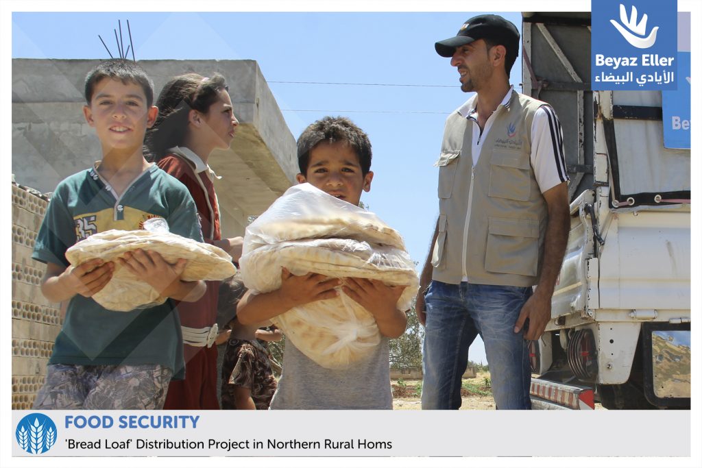 distributing bread loaf in northern rural homs
